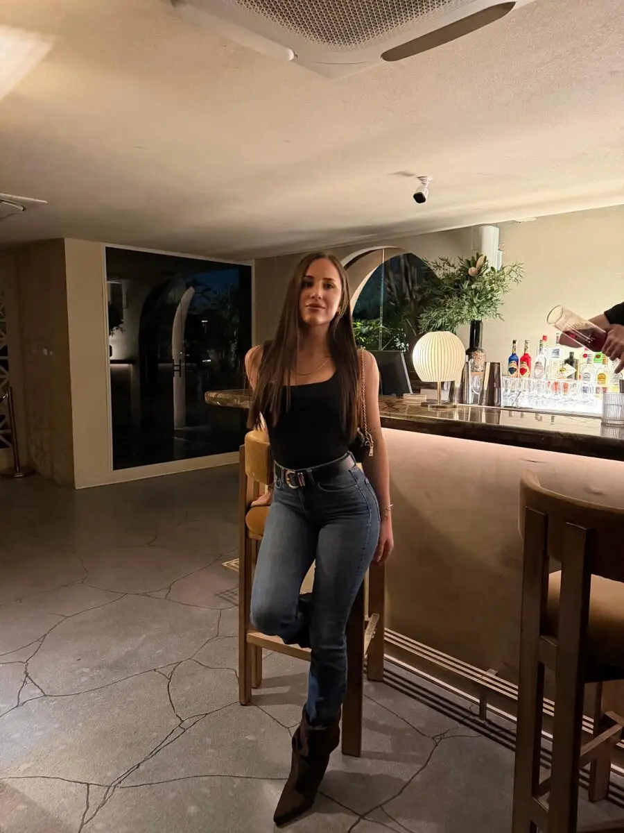 Stylish club outfit: jeans and black top