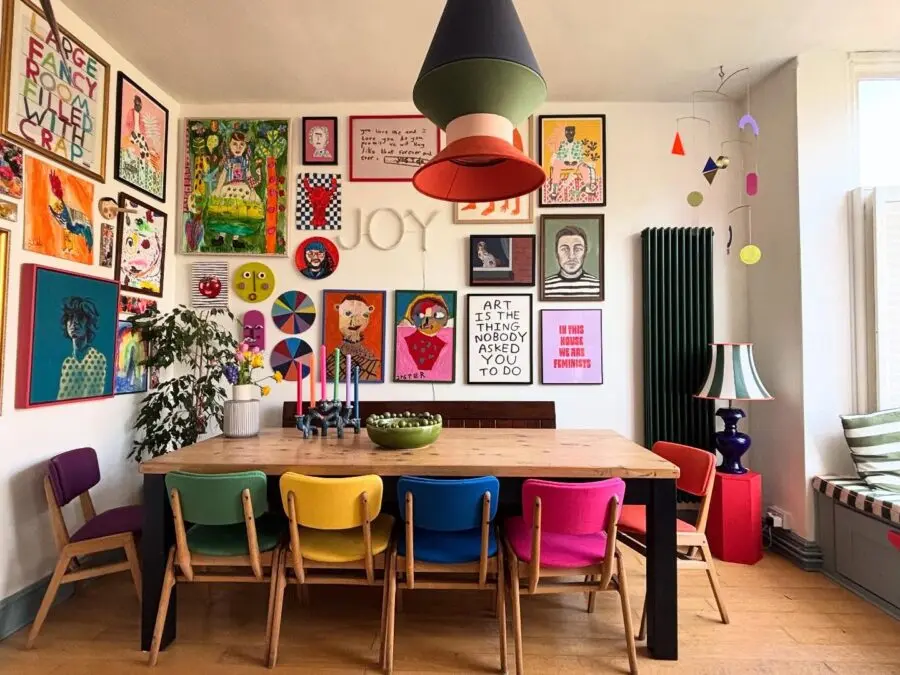 Vibrant eclectic dining room with bold art pieces