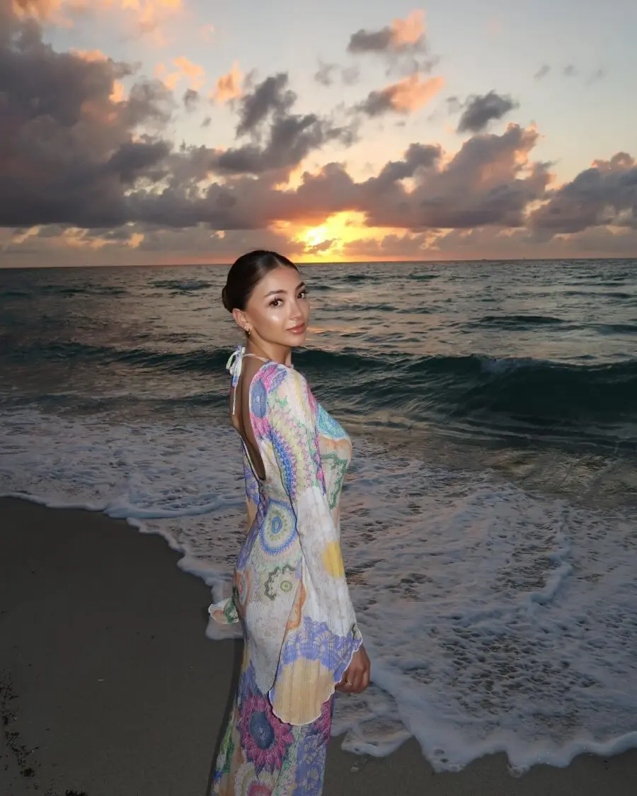 Colorful beach dress by the sunset waves