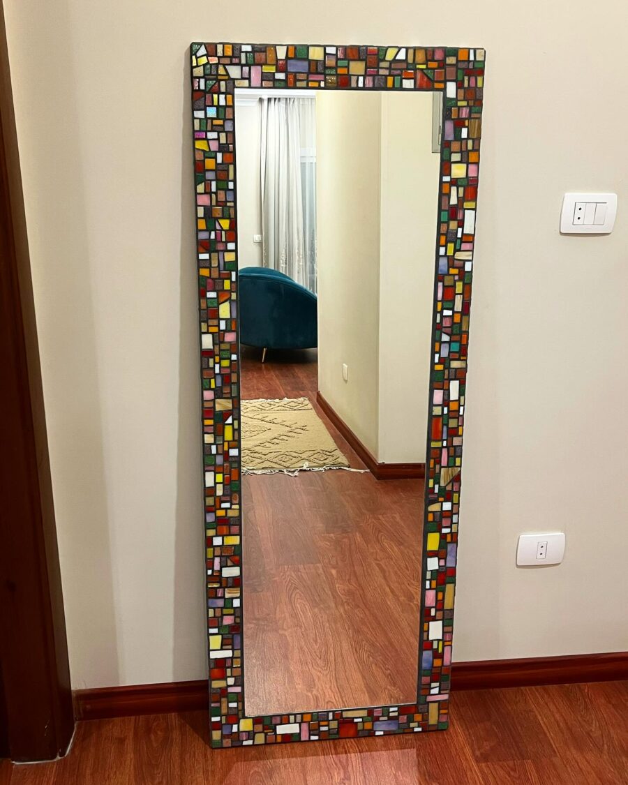 Vibrant mosaic mirror enhances home elegance