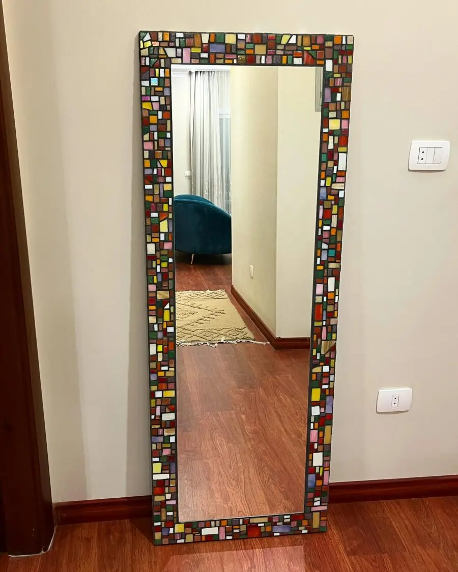 Vibrant mosaic mirror enhances home elegance