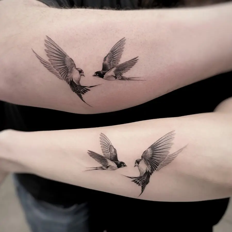 Matching bird tattoos symbolize love and freedom
