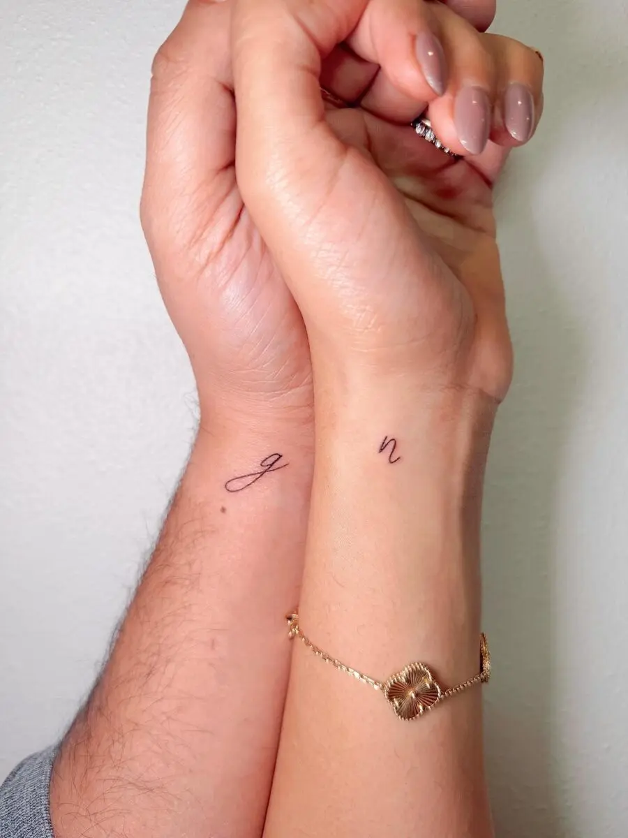 Minimalist couple tattoos showcasing initials