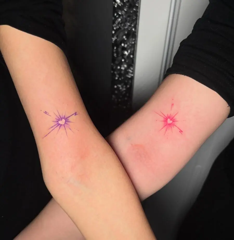 Vibrant couple tattoos of colorful sparks