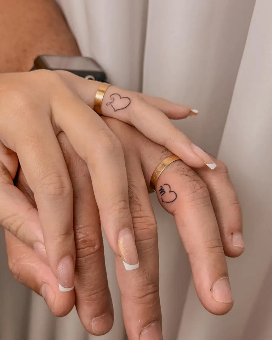 Matching Heart Tattoos on Ring Fingers