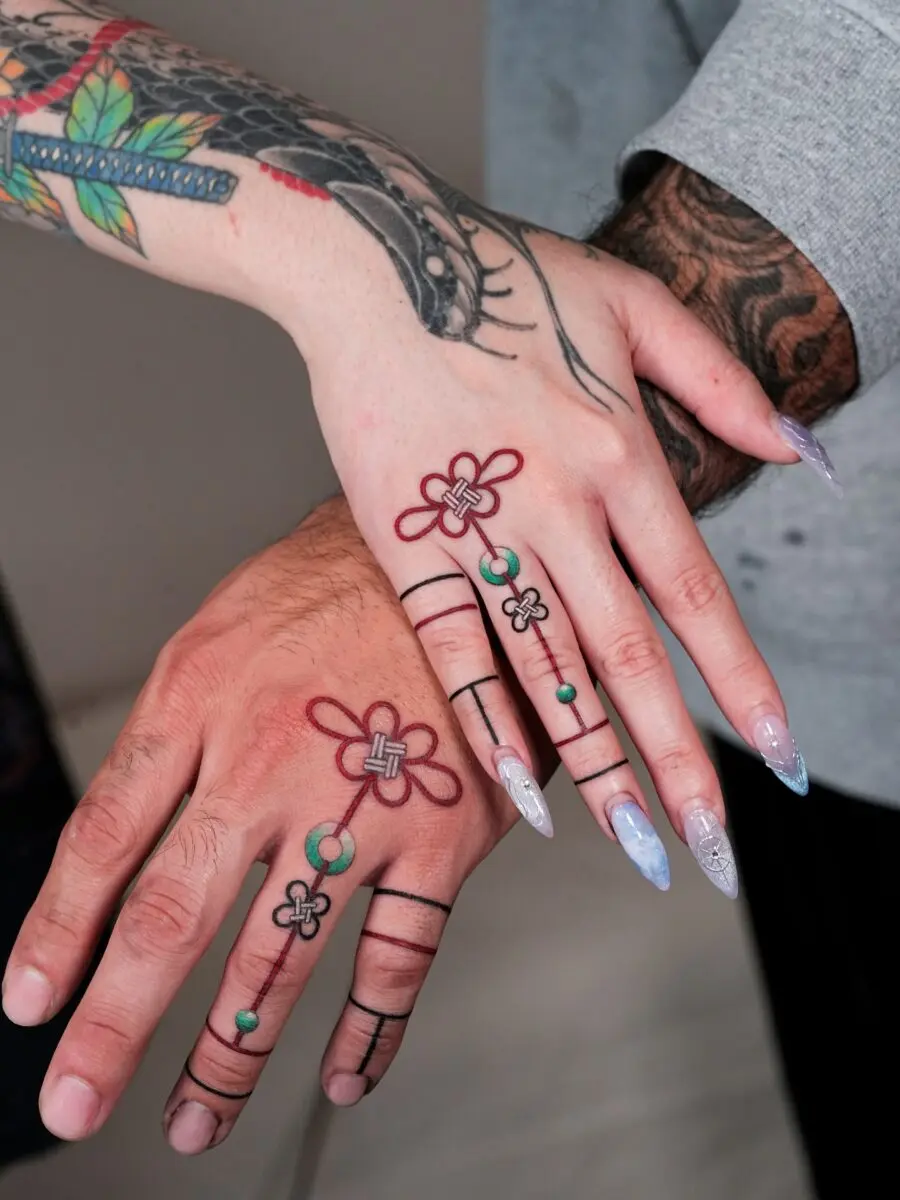 Meaningful flower tattoos for couples' hands
