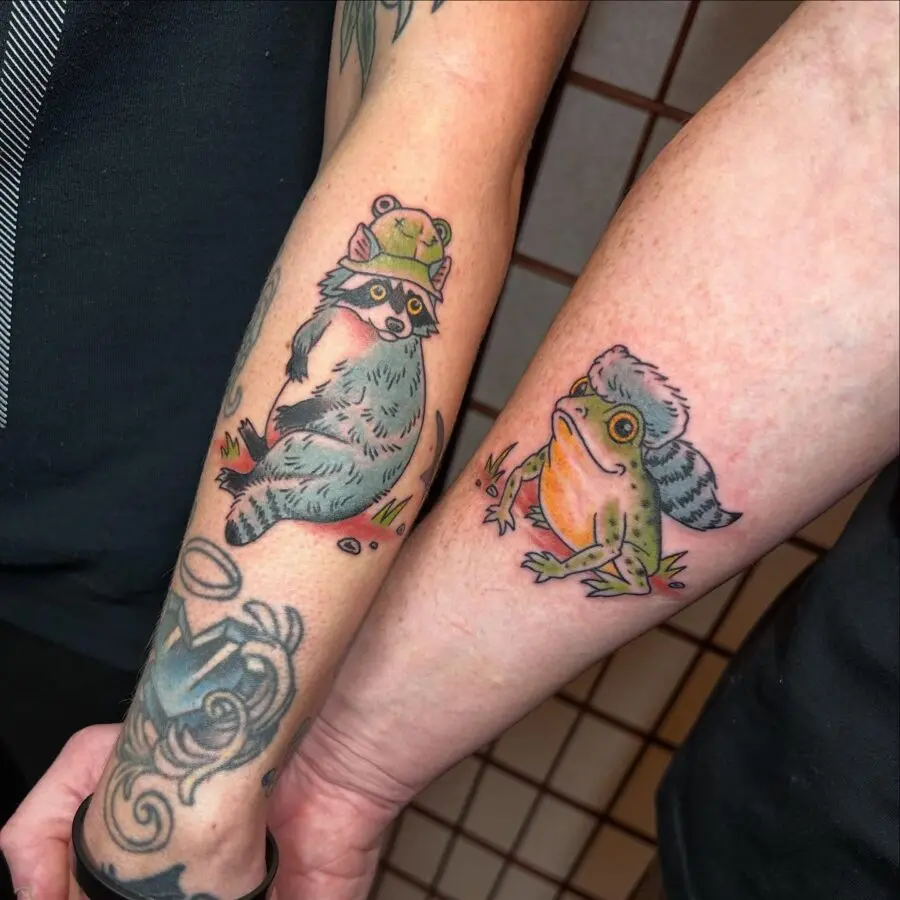 Cute couple tattoos of a frog and raccoon