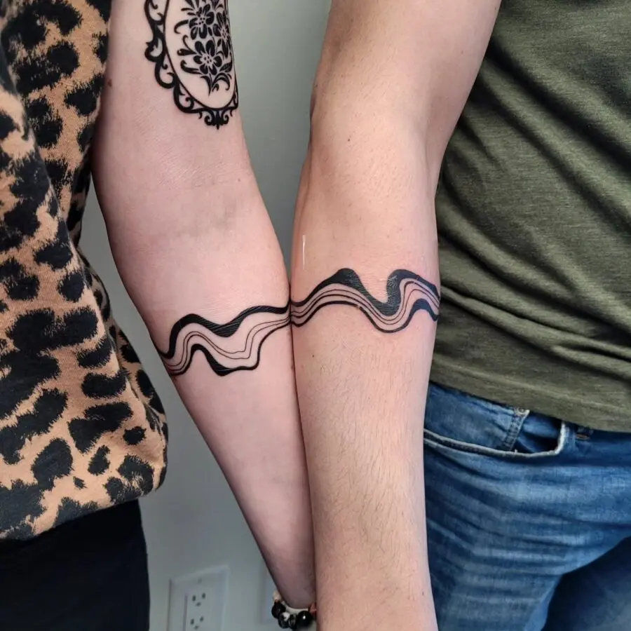 Stylish line wave tattoos symbolizing connection