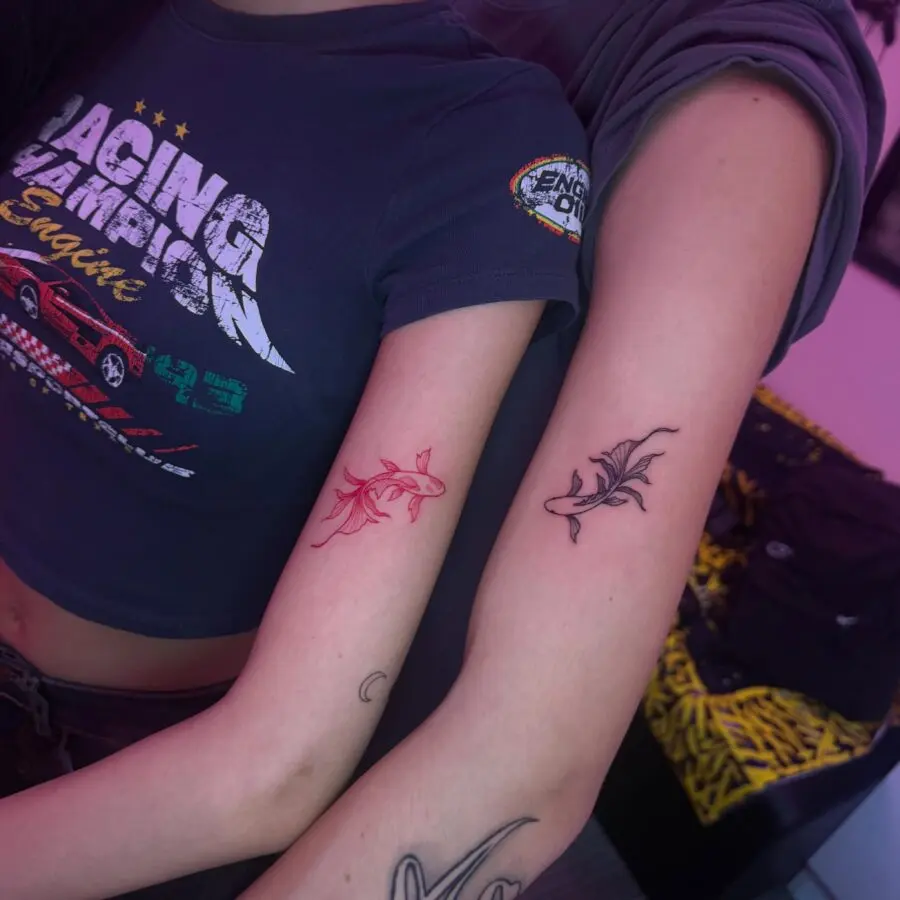 Matching shark tattoos for adventurous couples