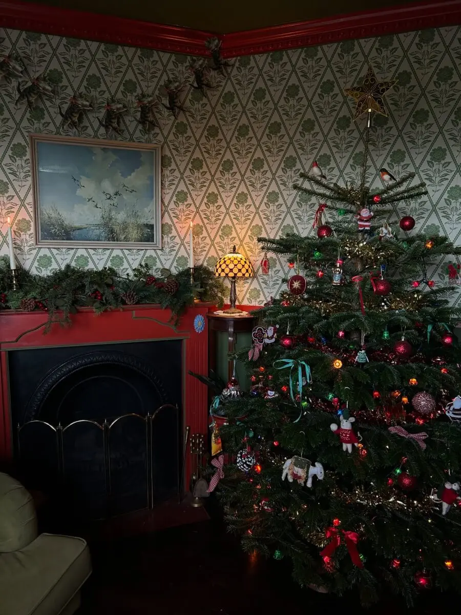 Charming vintage Christmas tree adorns cozy space