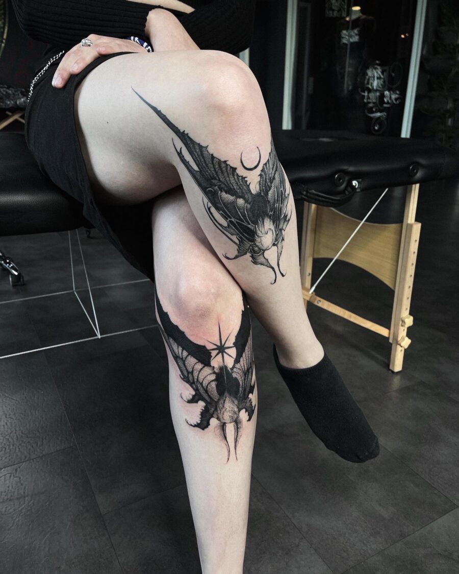 Intricate dark feminine bat tattoo on leg