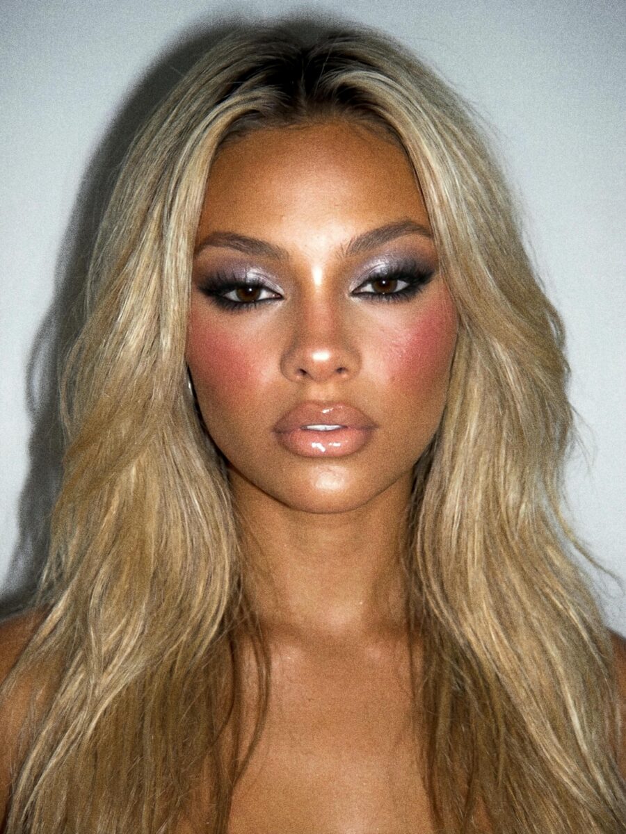 Glamorous dark feminine makeup with bold accents