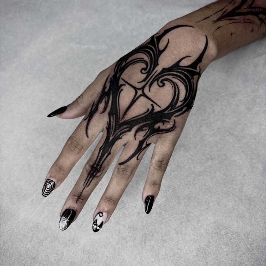 Intricate dark hand tattoo design for empowerment