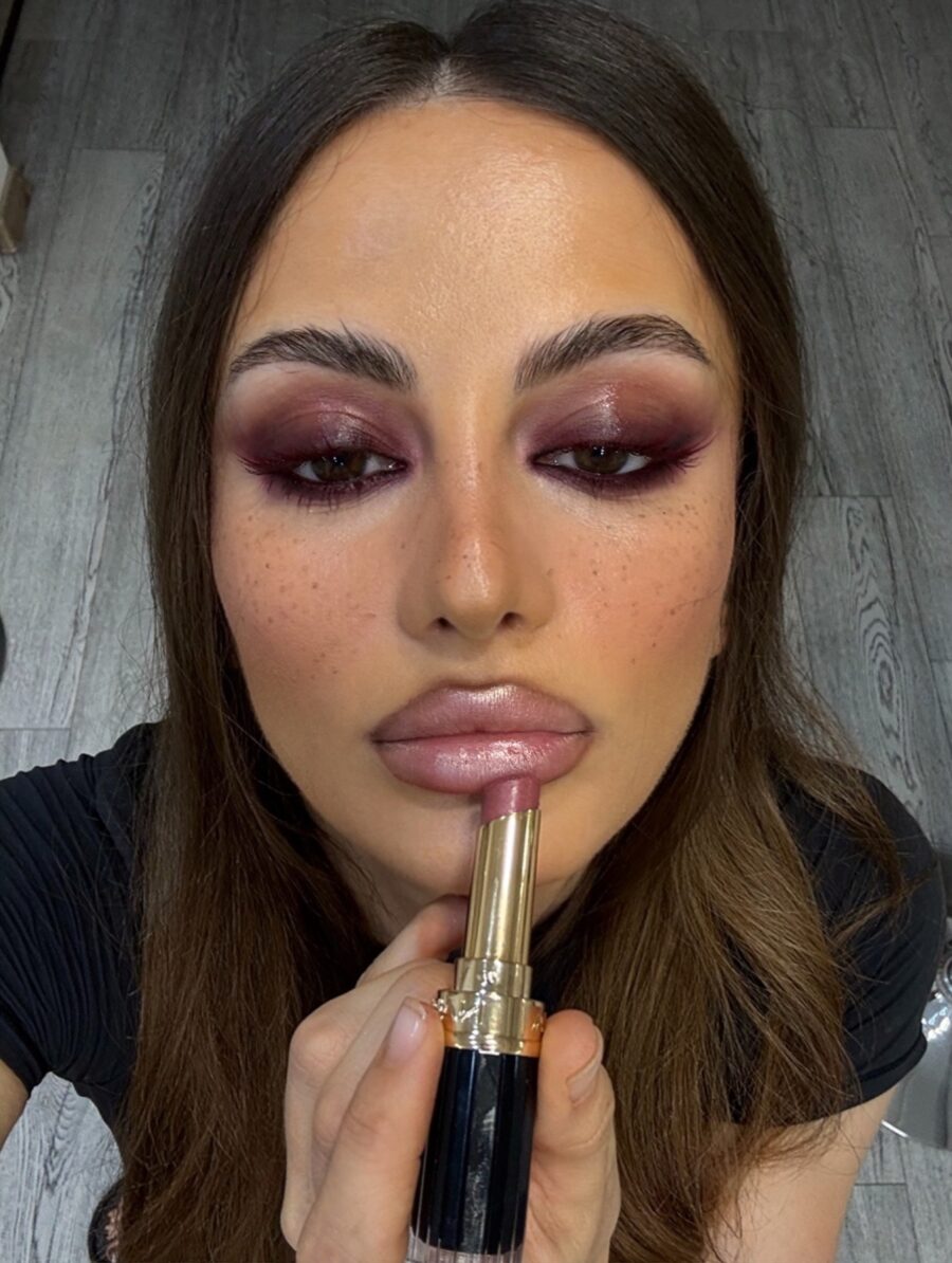 Bold eyes and glossy lips for dark femininity