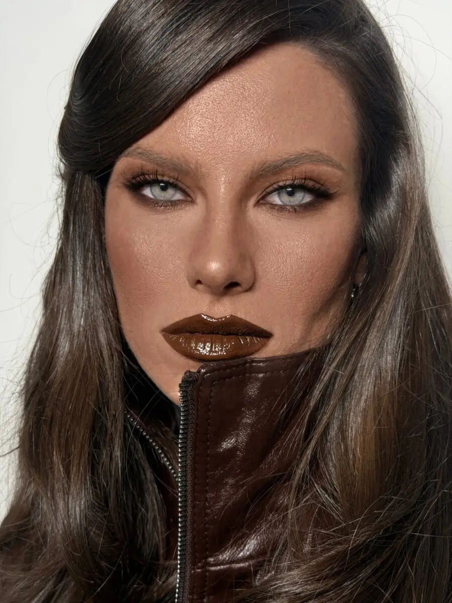 Bold dark feminine makeup with brown lips