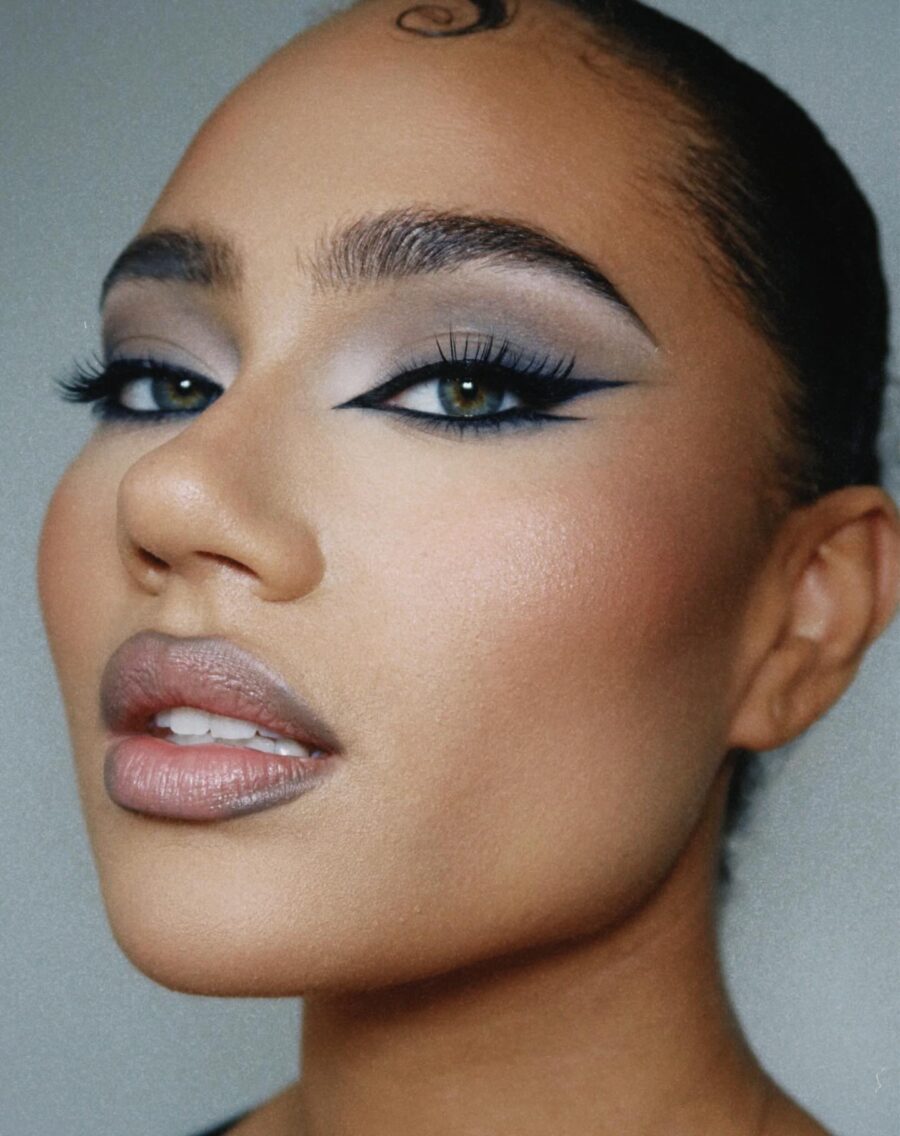 Elegant dark feminine makeup with bold features