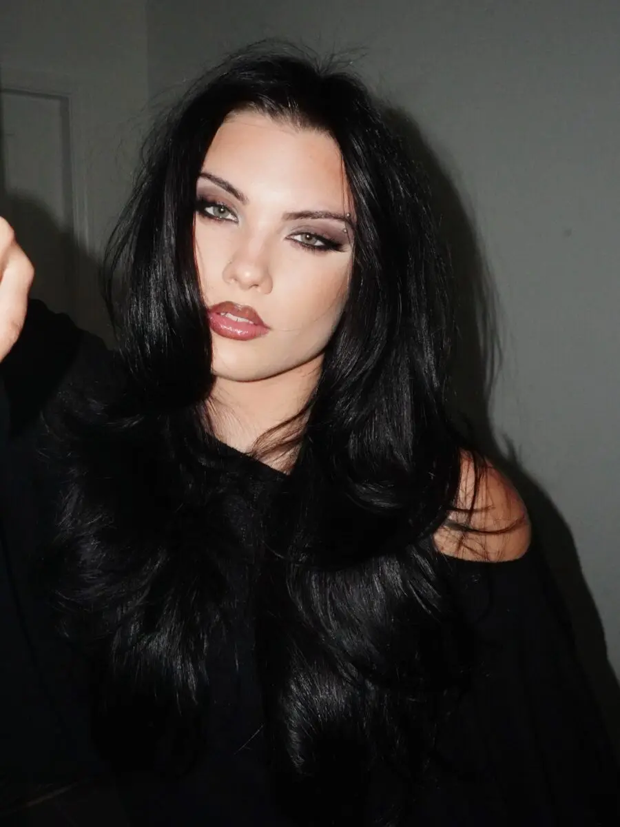 Bold dark feminine makeup with striking features