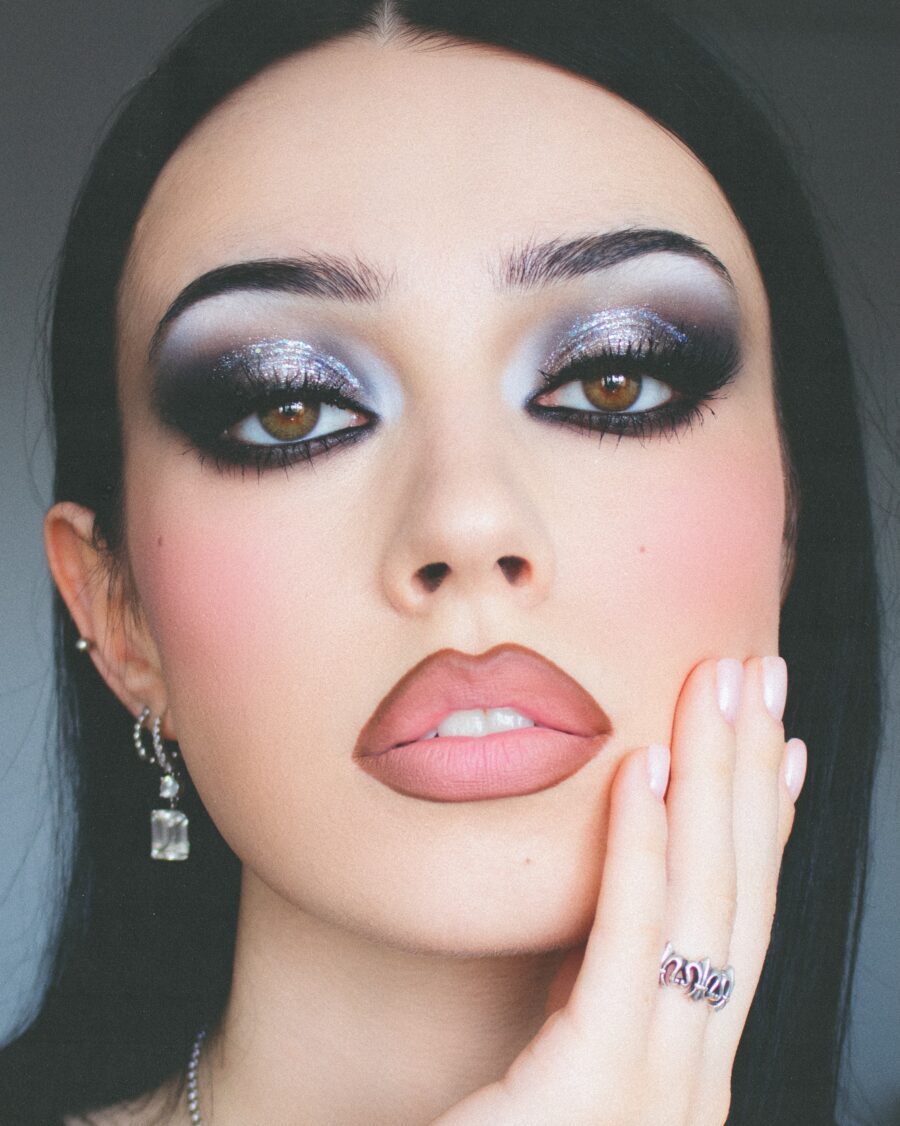 Sparkly glam meets dark elegance in makeup