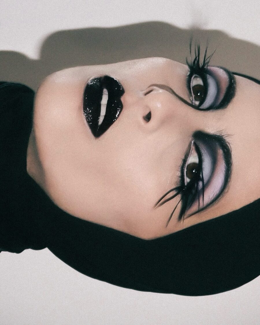 Glamorous dark feminine makeup style revealed.