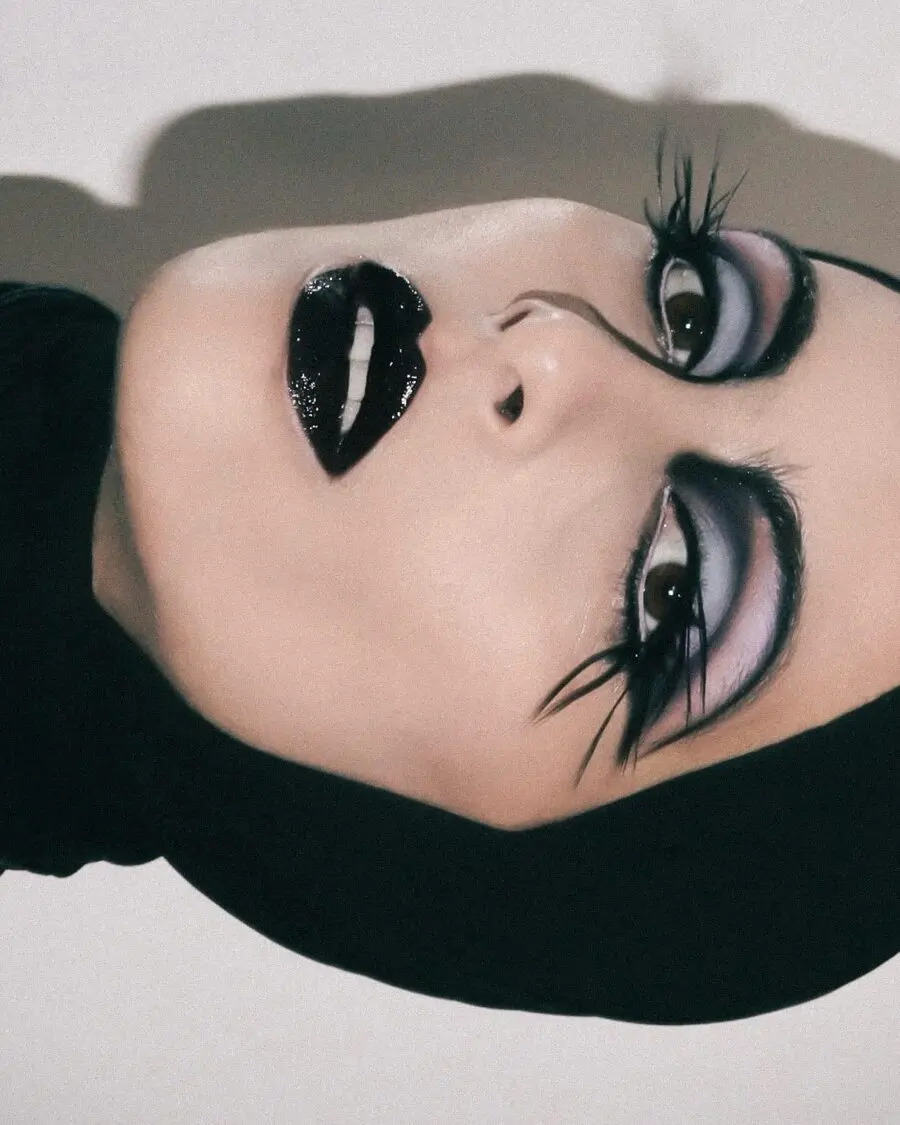 Glamorous dark feminine makeup style revealed.
