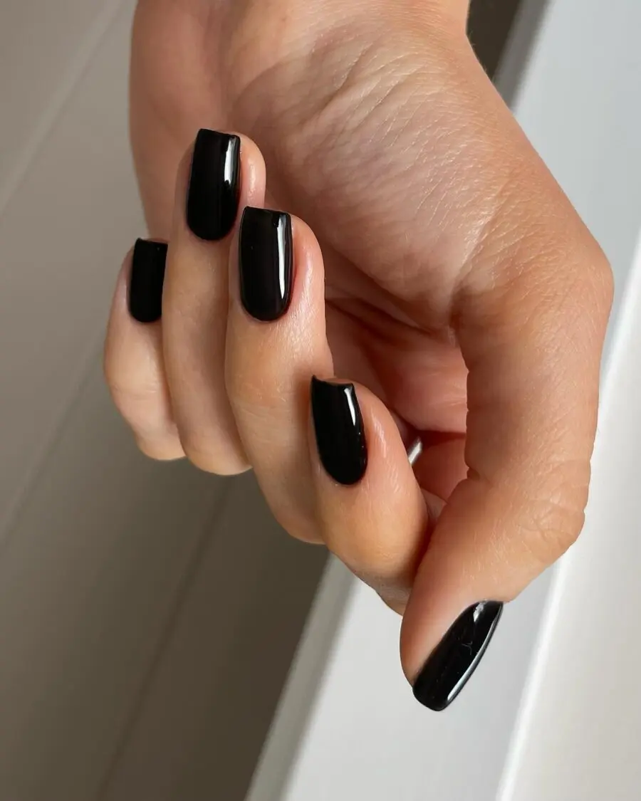 Sleek glossy black nails for a dark vibe