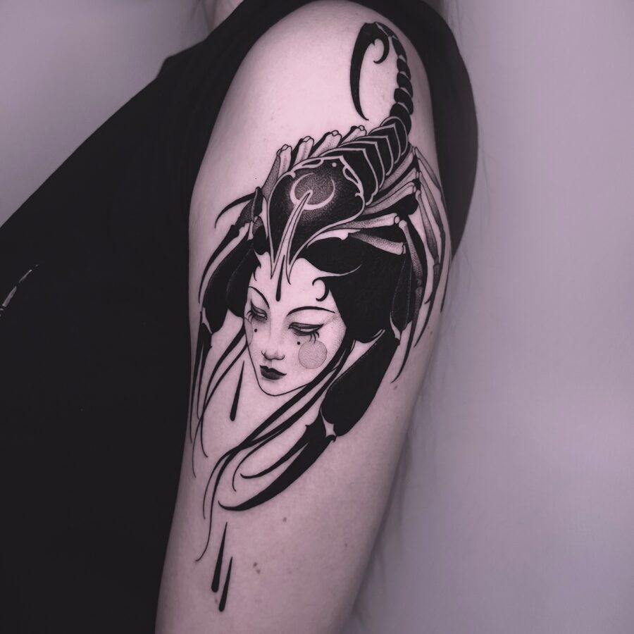 Intricate scorpion-themed feminine tattoo design
