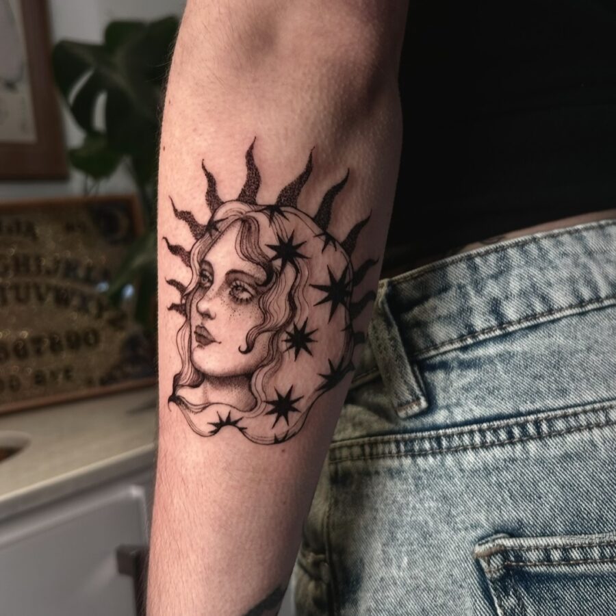 Intricate sun and moon feminine tattoo design