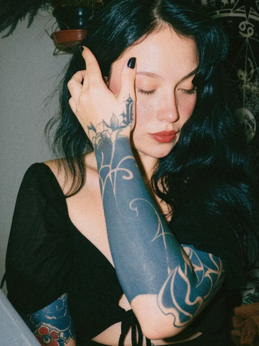 Symbolic dark feminine tattoo aesthetics