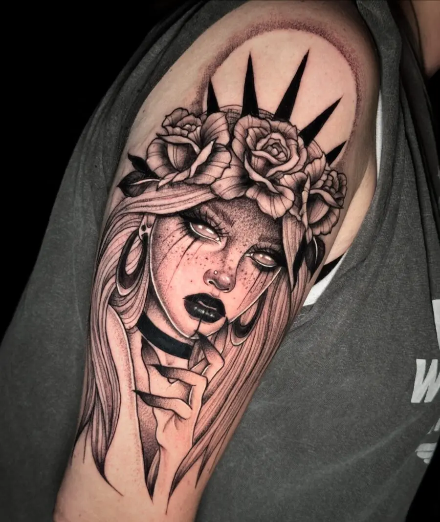 Striking dark feminine tattoo with floral elements