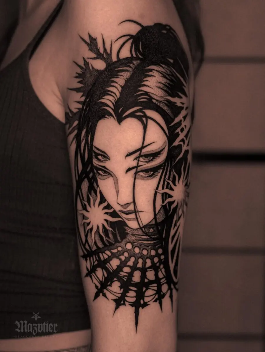 Intricate dark feminine tattoo showcasing strong features