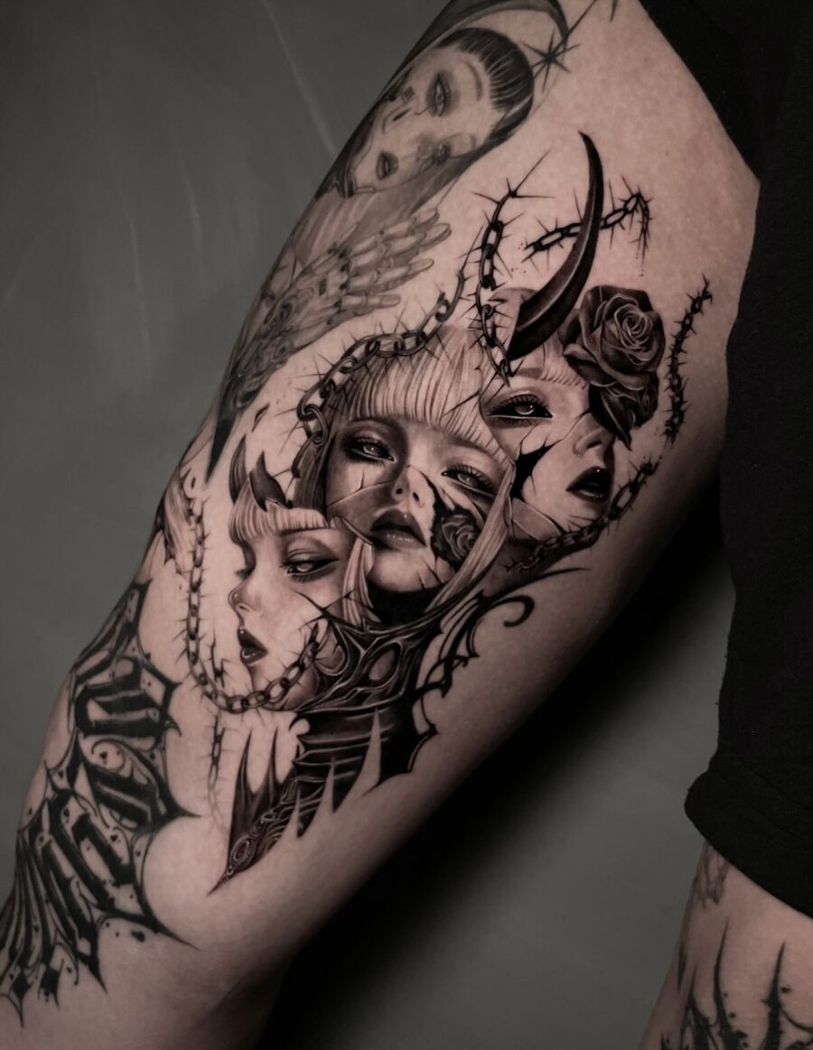 Intricate dark feminine tattoo with haunting faces