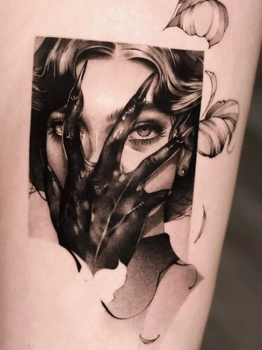 Mysterious dark feminine tattoo with haunting imagery