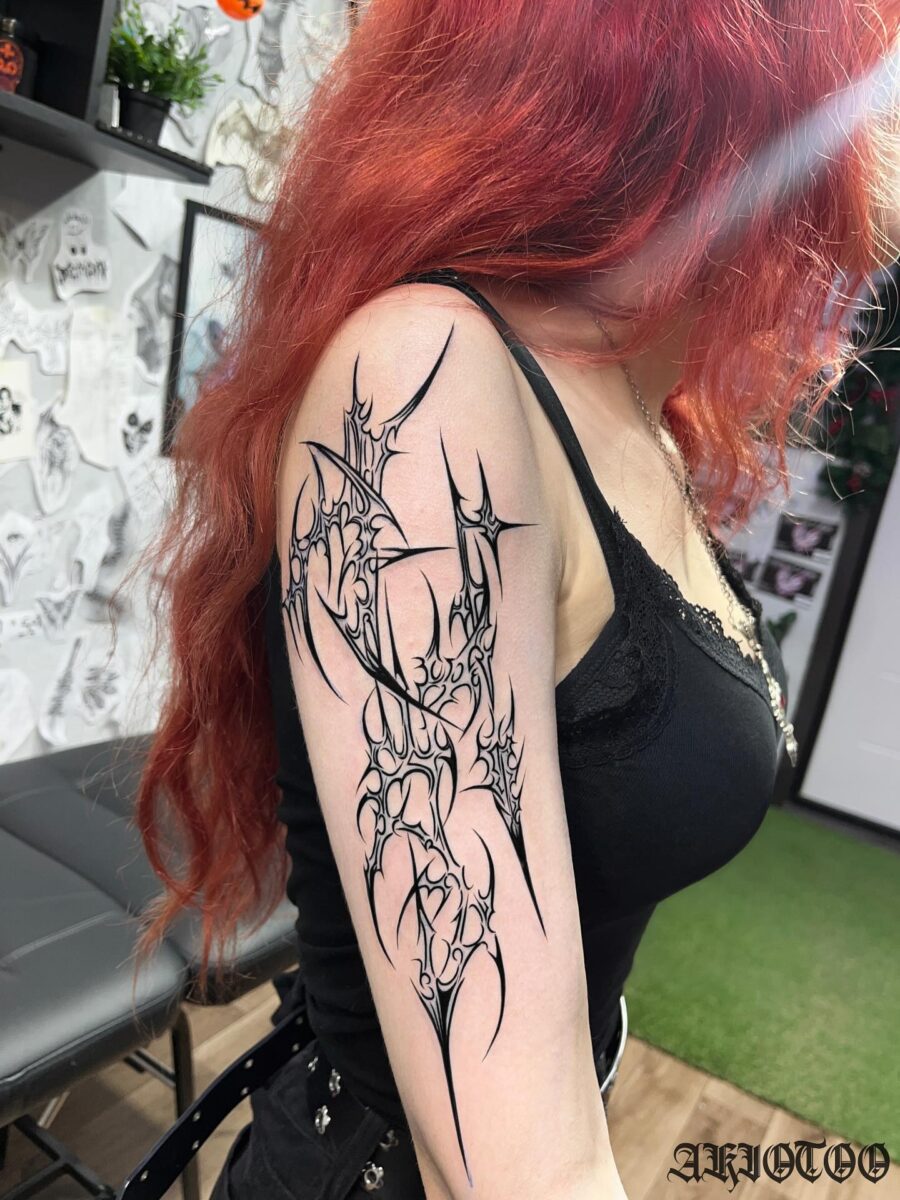 Striking dark feminine tattoo with intricate details