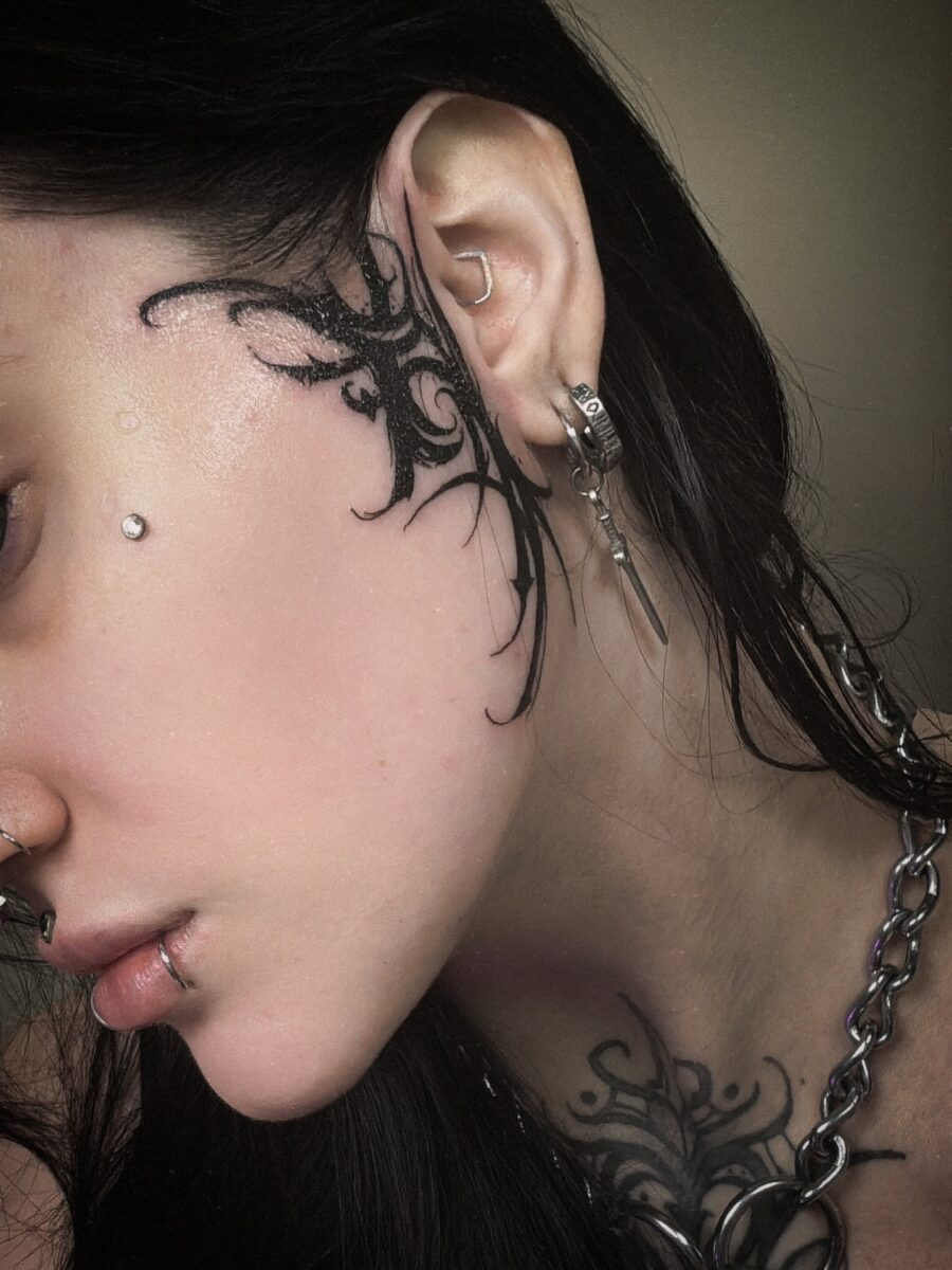 Intricate dark feminine tattoos on skin