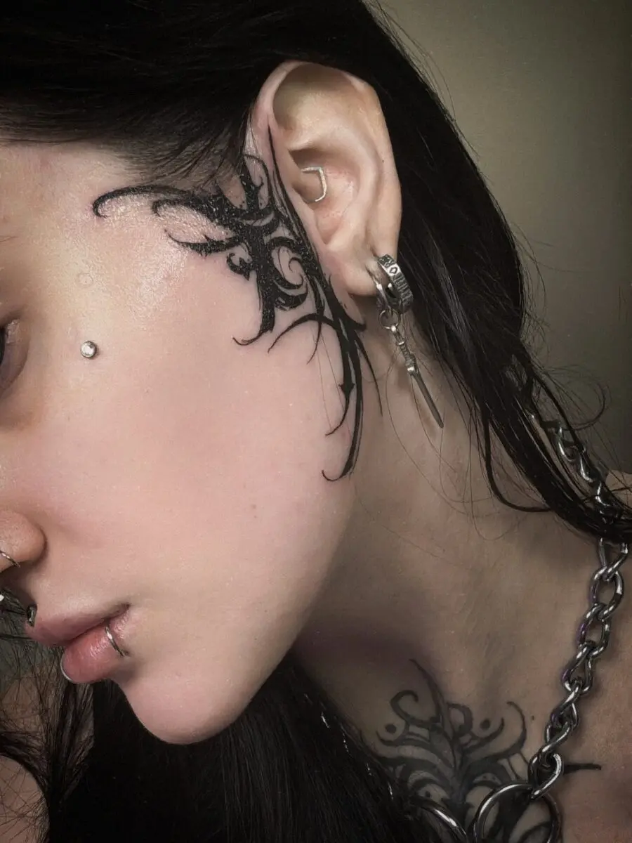 Intricate dark feminine tattoos on skin