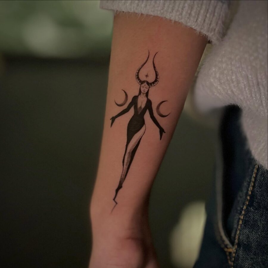 Elegant Dark Feminine Tattoo with Mystical Elements