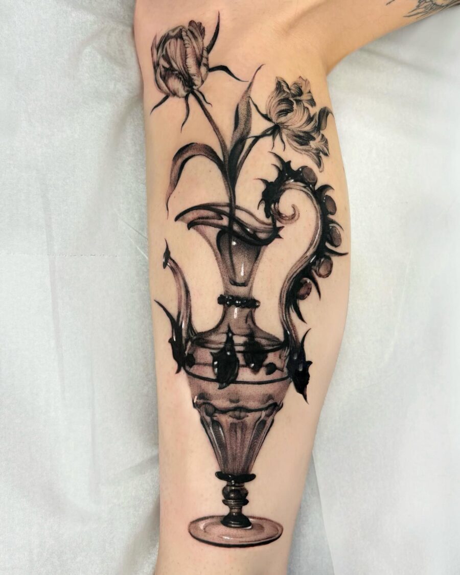Intricate vase with blooming dark florals