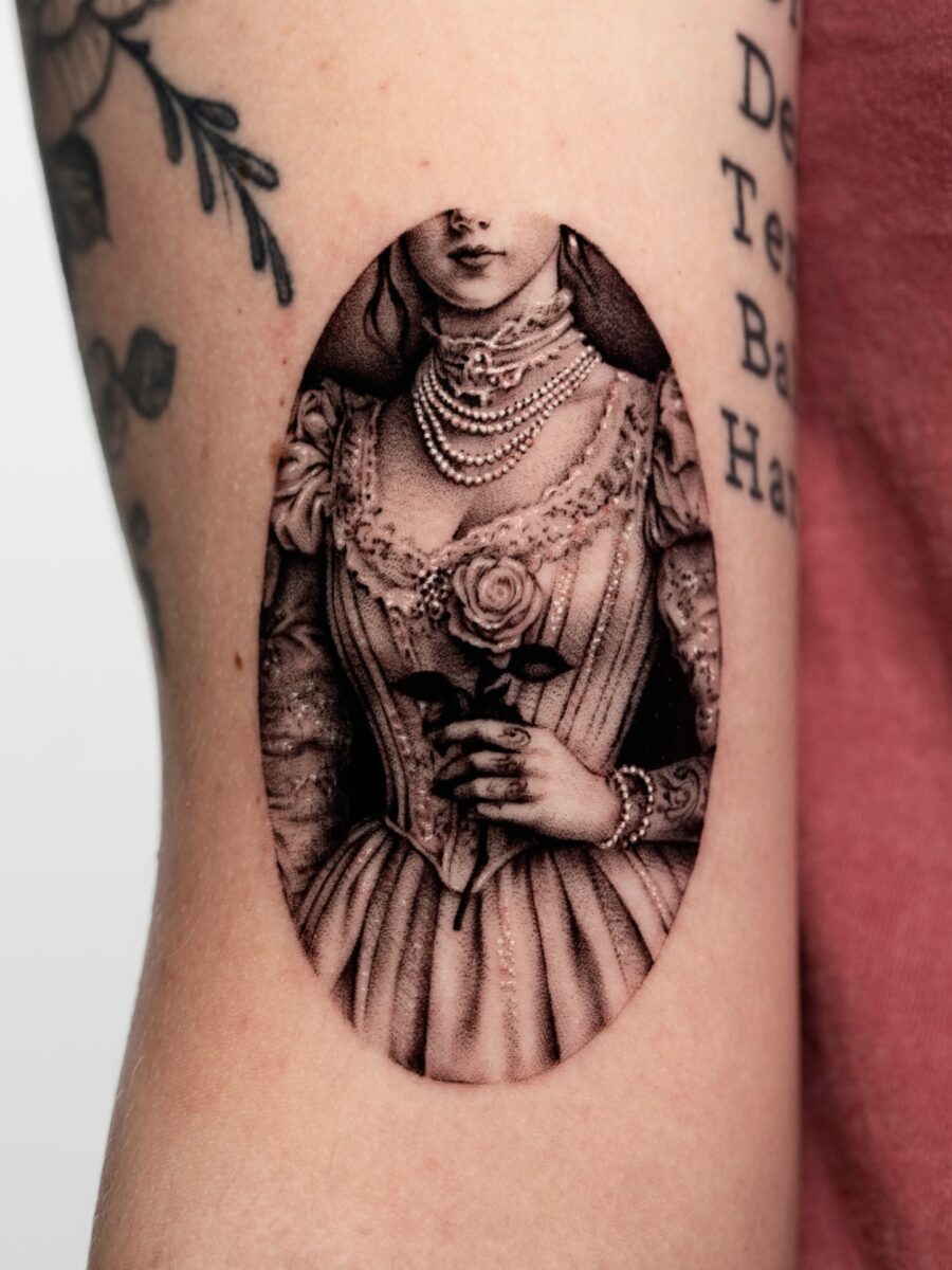 Elegant vintage lady tattoo with floral accents