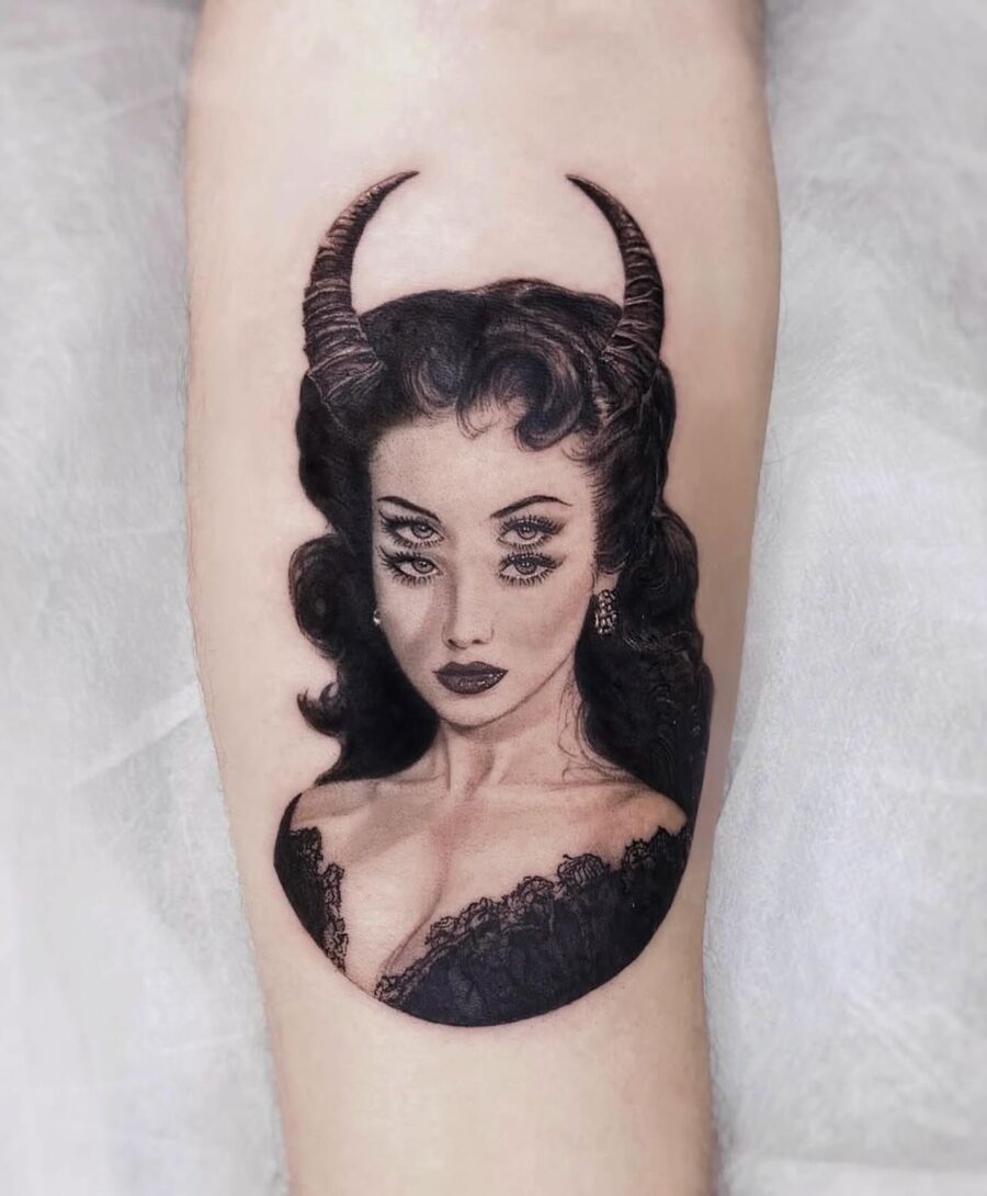 Intriguing dark feminine tattoo with horns
