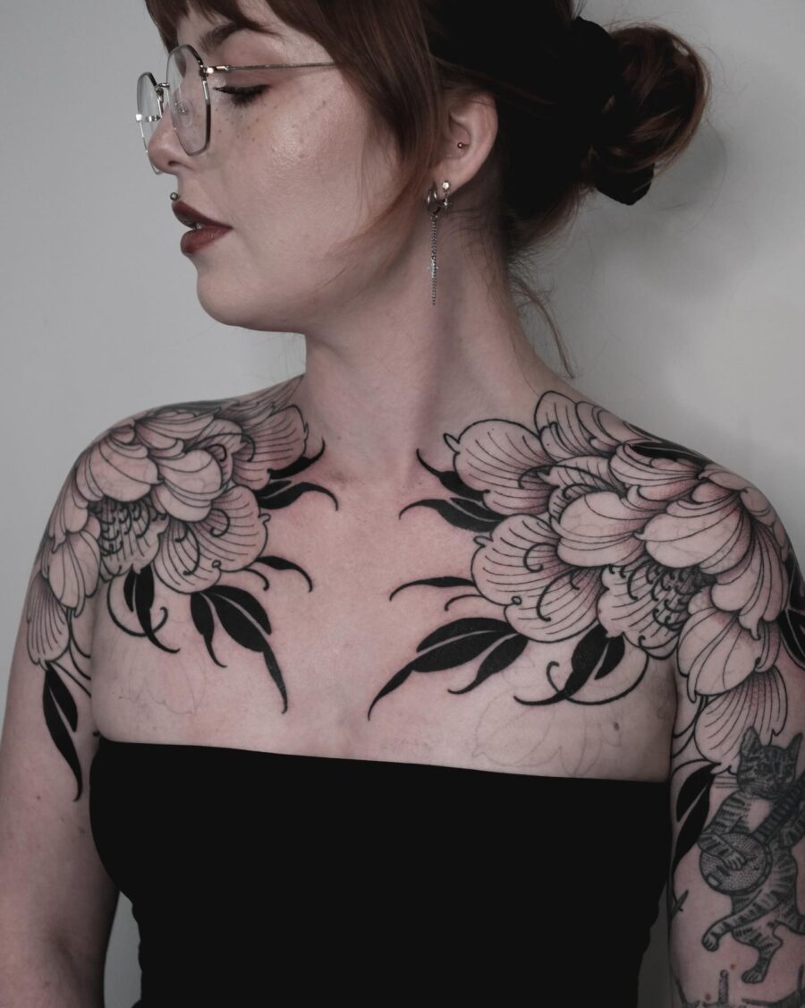 Elegant floral tattoos embody dark femininity