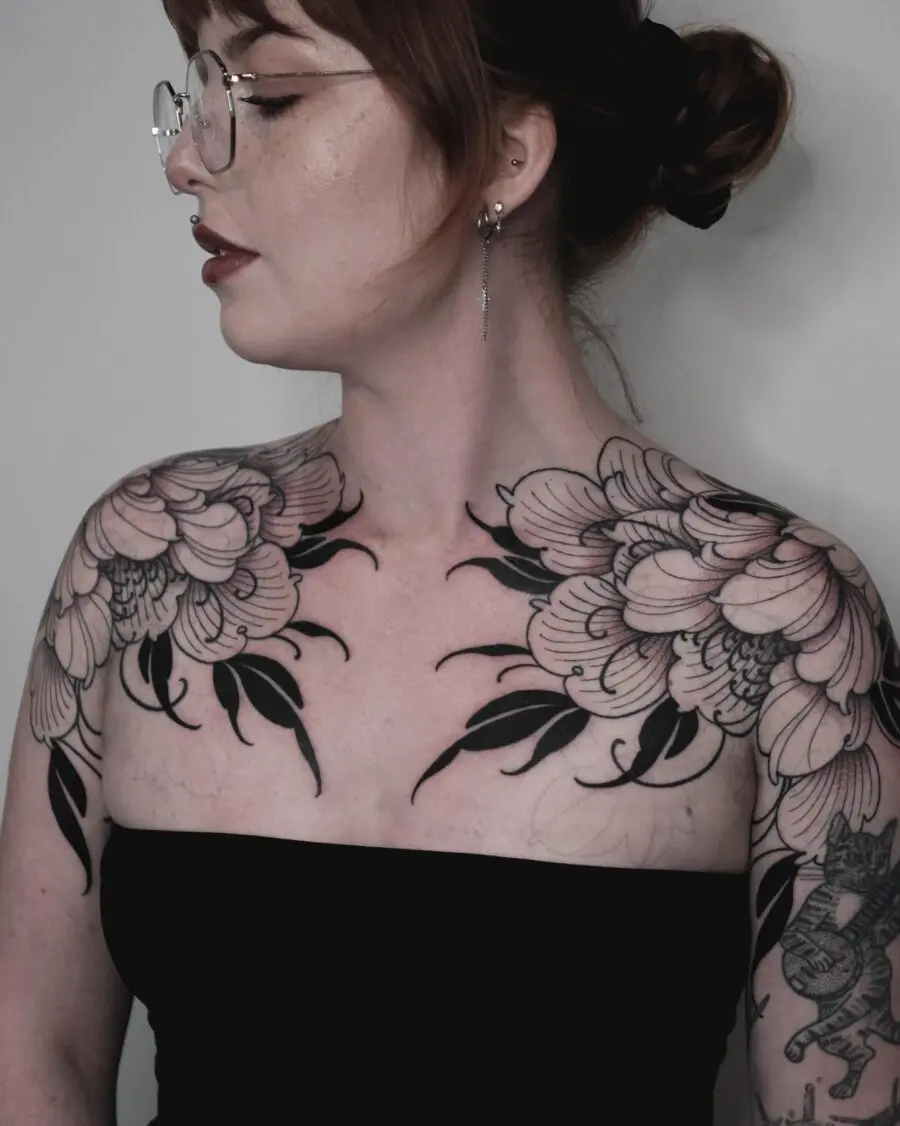 Elegant floral tattoos embody dark femininity