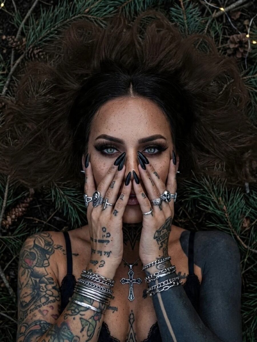 Captivating dark feminine tattoo artistry on display