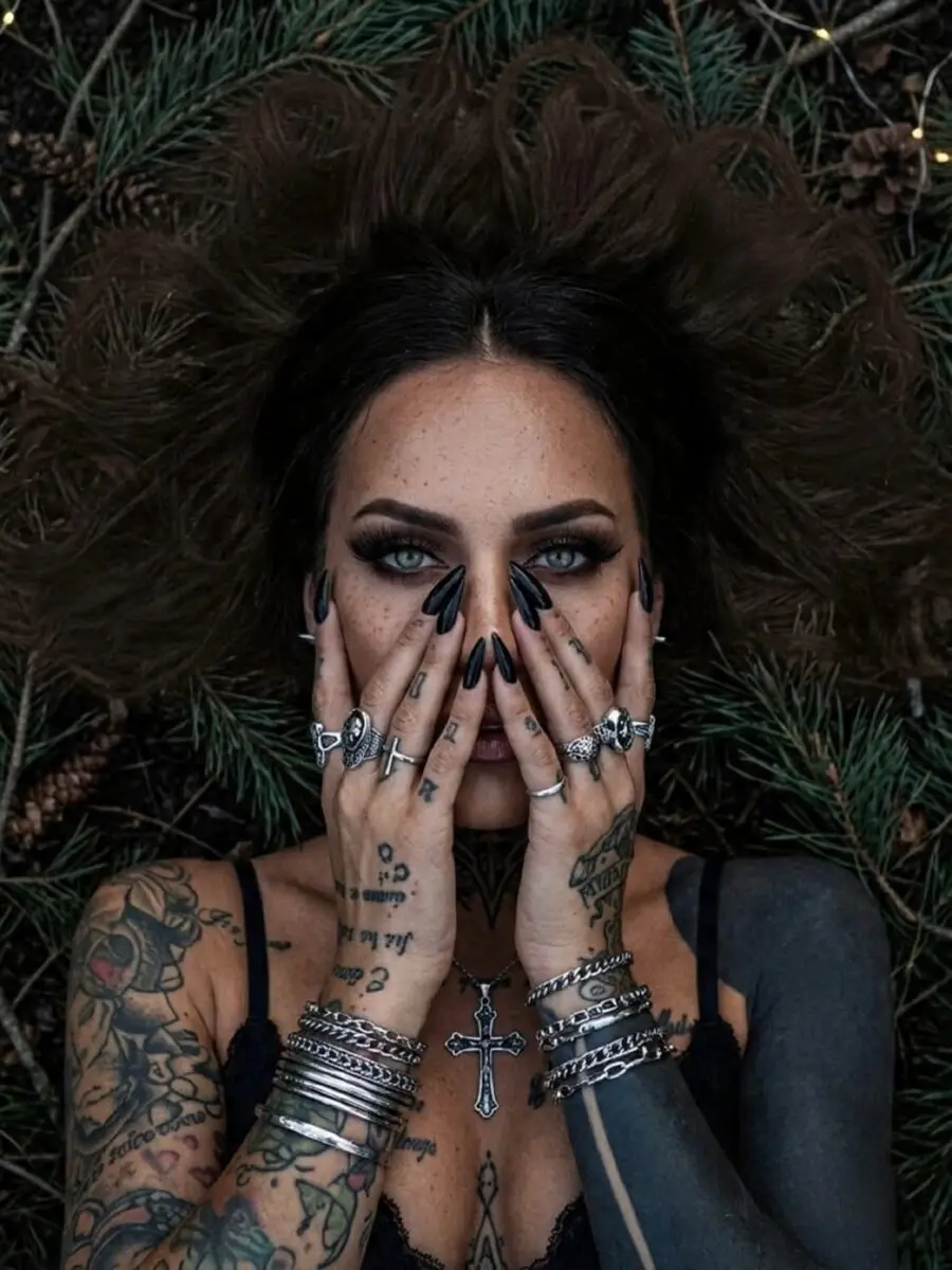 Captivating dark feminine tattoo artistry on display