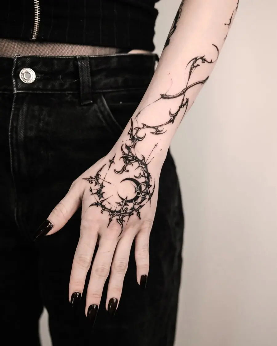Intricate shadowy design adorns the hand