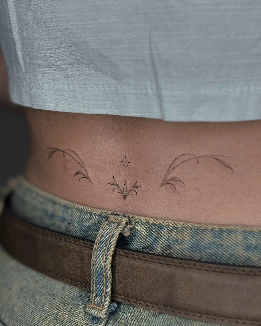 Elegant floral tramp stamp tattoo design