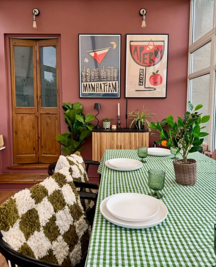Stylish dining room with modern art and greenery