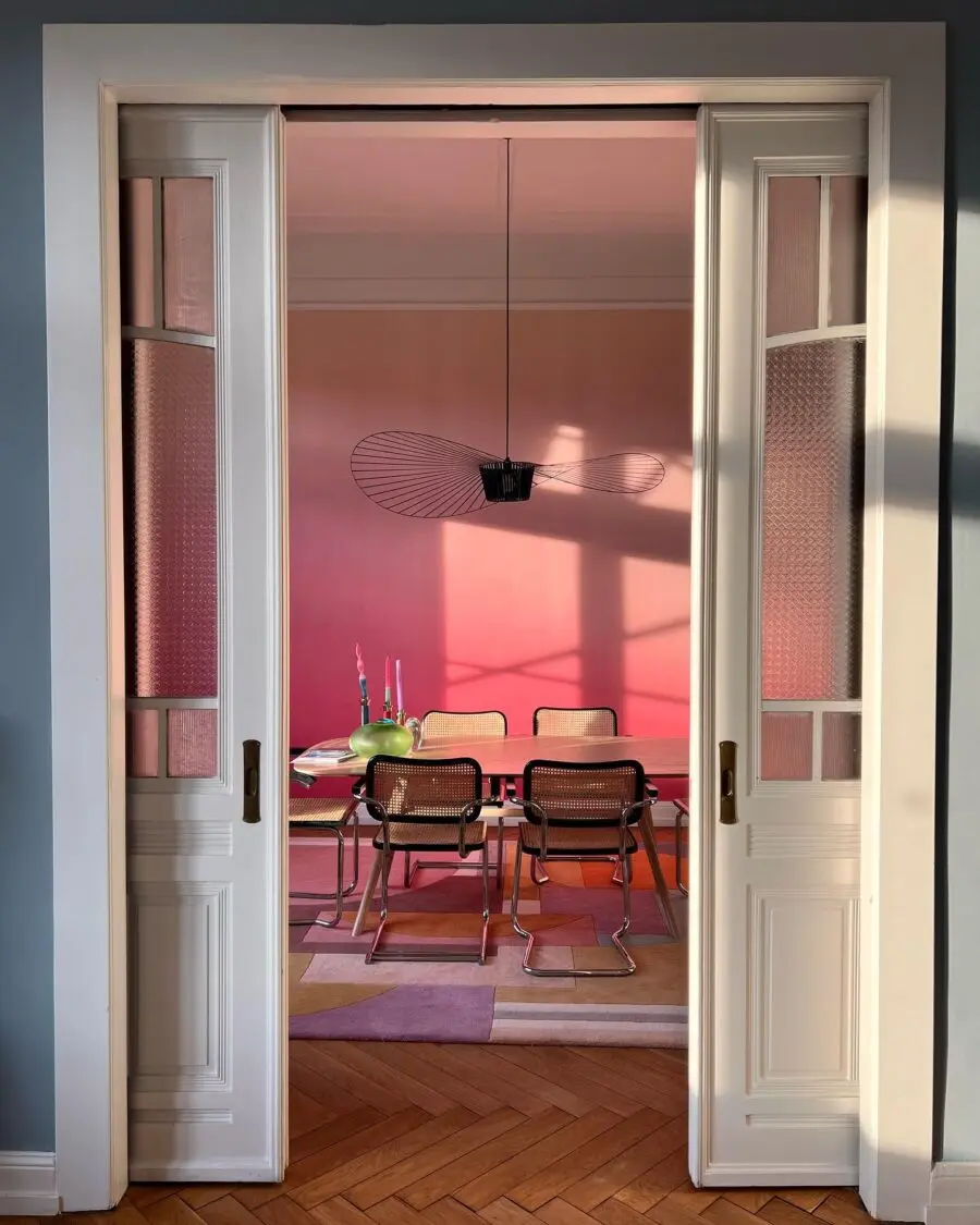 Contemporary dining room with vibrant pink hues