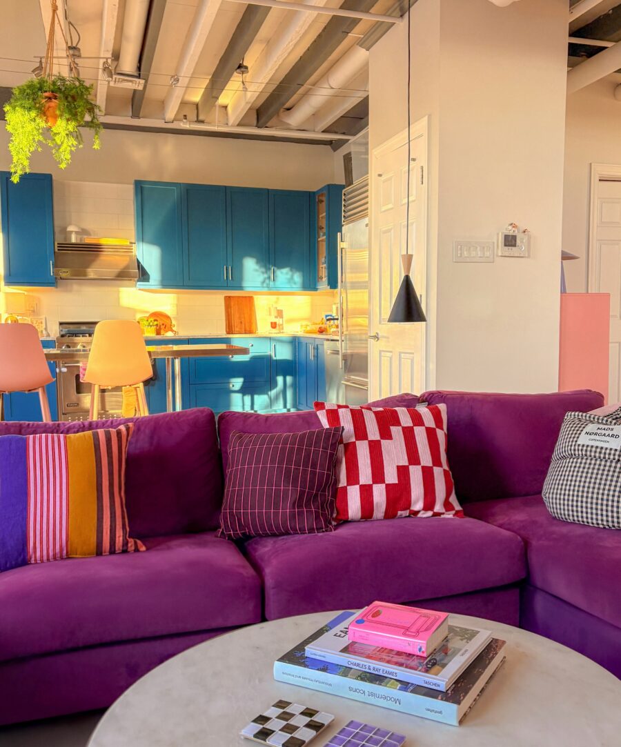 Vibrant purple sofa with stylish decor elements
