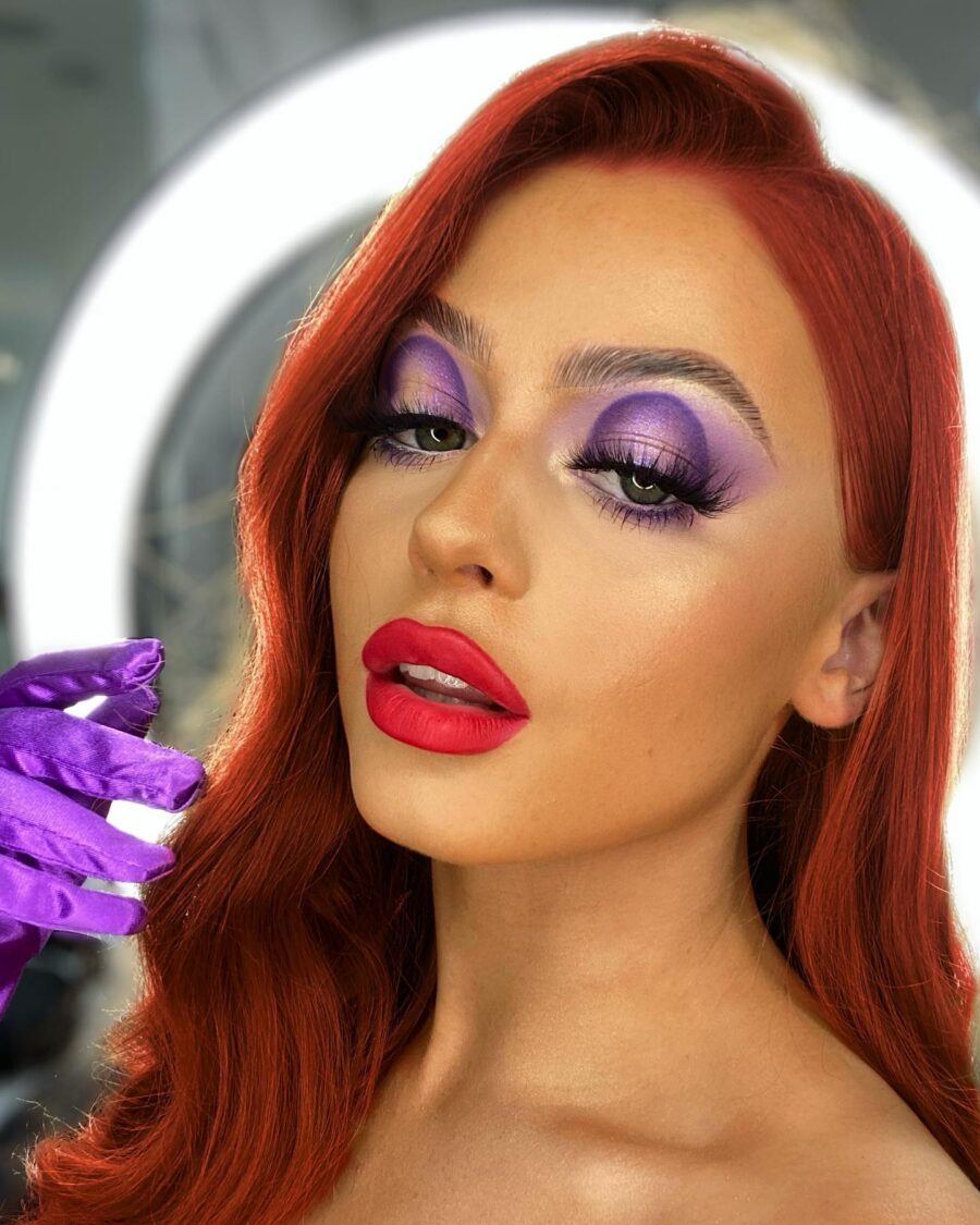 Bold purple and red drag queen makeup look