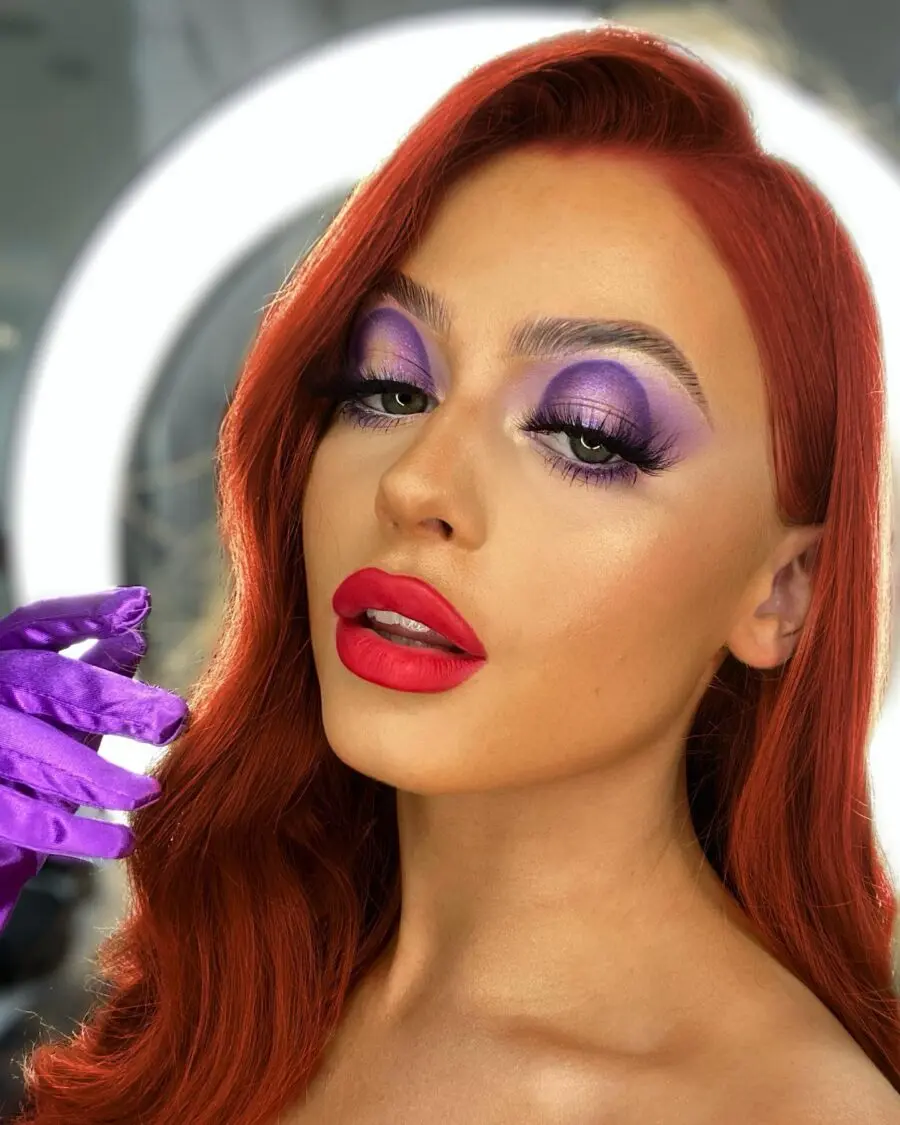 Bold purple and red drag queen makeup look